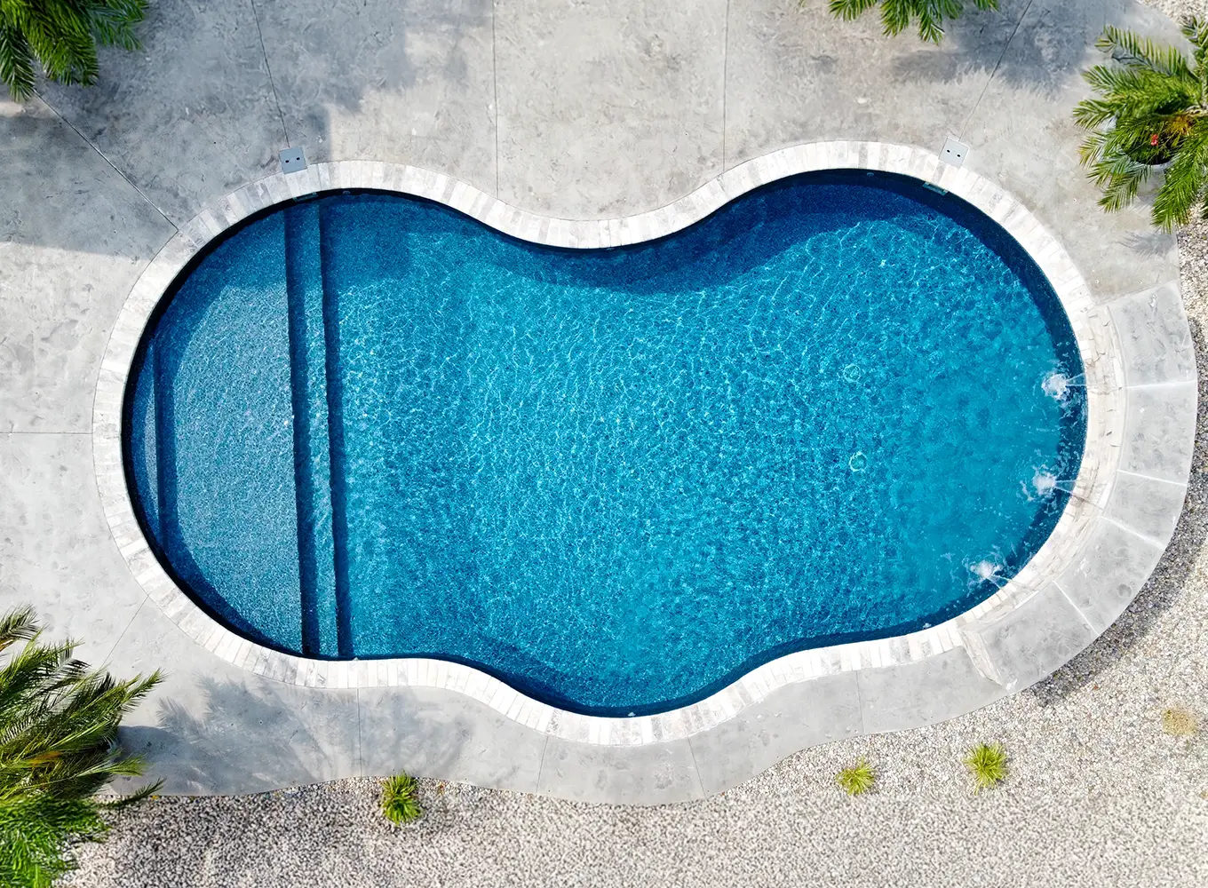 Fiberglass pool with custom water feature add-on in Collinsville IL